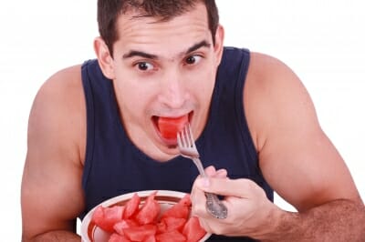 Man eating watermelon