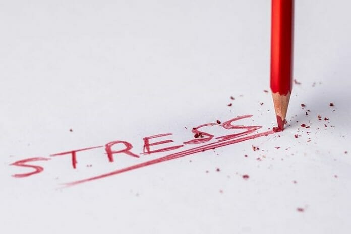 Pencil writing the word Stress
