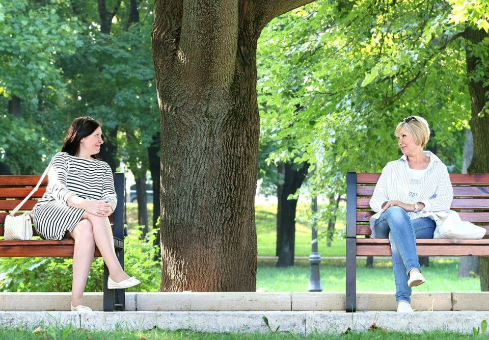 2 women talking in the park